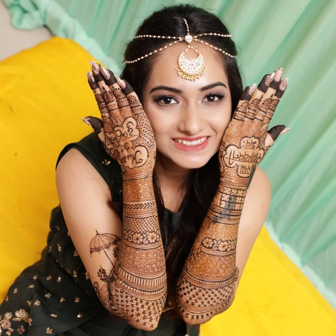 Pre-wedding beauty look framed by detailed mehendi